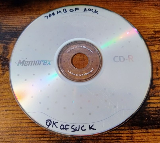 CD-R titled "700mb of rock, 0k of suck"