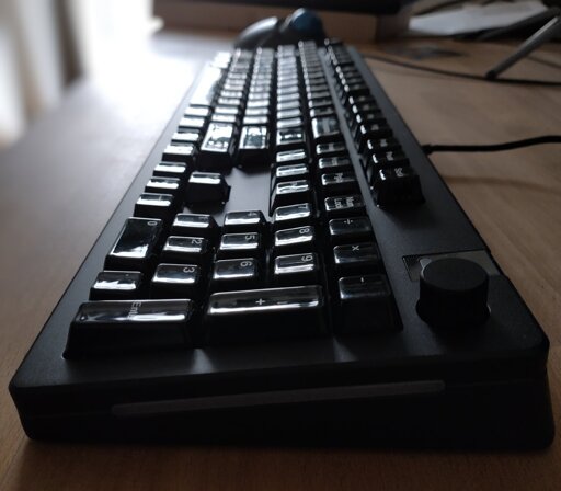 A black mechanical keyboard photographed from the side. 